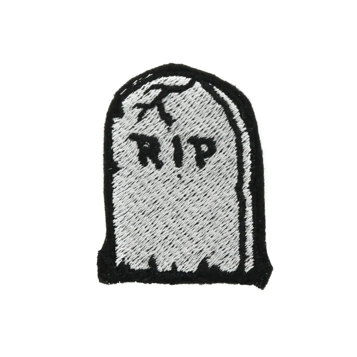 embroidered patch of an old cracked tombstone, with the inscription “RIP”. Black and grey stitching