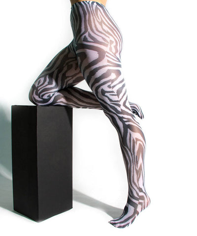 bold black and white zebra print opaque tights, shown on model
