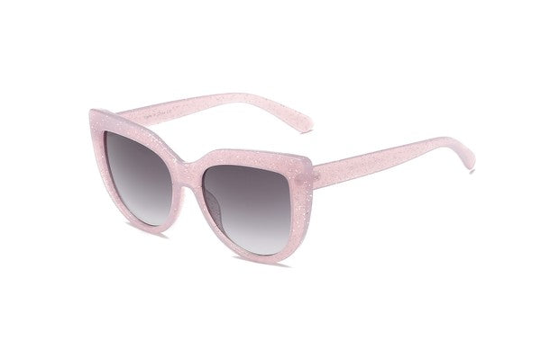 Thick glitter infused translucent pink plastic frame cat eye sunglasses with gradient smoke lens, shown 3/4 view