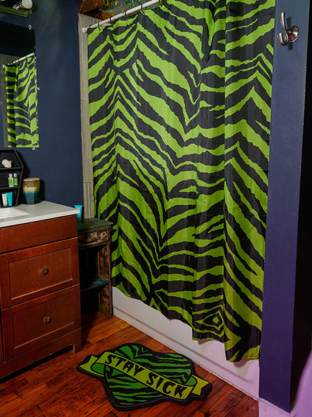 72" x 72" Polyester acid green zebra  print shower curtain with black plastic rings included, shown with matching bath mat