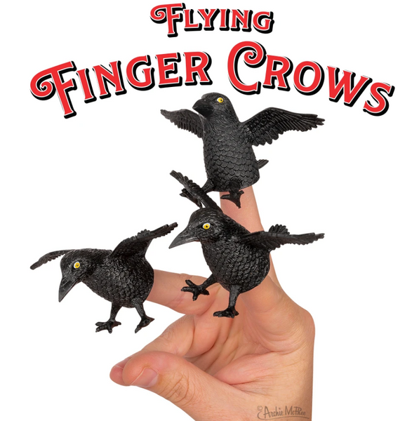 "Flying Finger Crows" red text over photo image of three 2" soft vinyl black crow finger toppers shown on a hand
