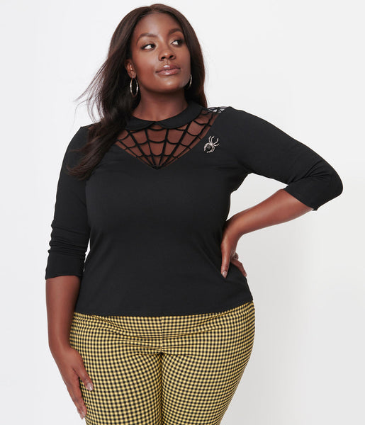 black stretch knit top with 3/4 sleeves, Peter Pan collar, front and back v-shaped spiderweb mesh neckline design, and removable jeweled spider brooch. shown on model