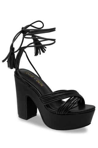 black faux leather platform sandal with tassel-tipped ankle tie straps and matching strappy crossed design vamp