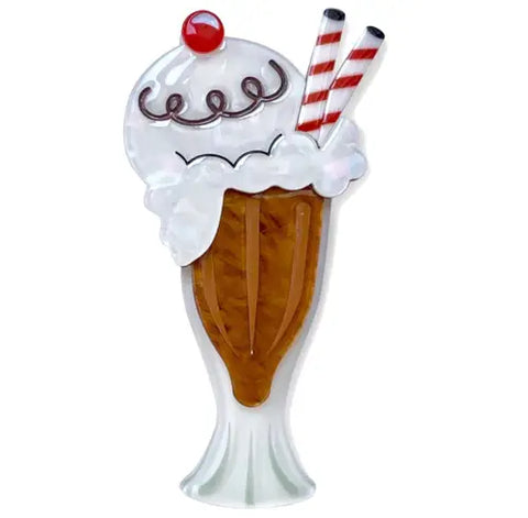 A layered resin brooch of a root beer float with two straws