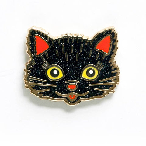 glitter black cat face with yellow eyes and orange details enameled gold metal lapel pin
