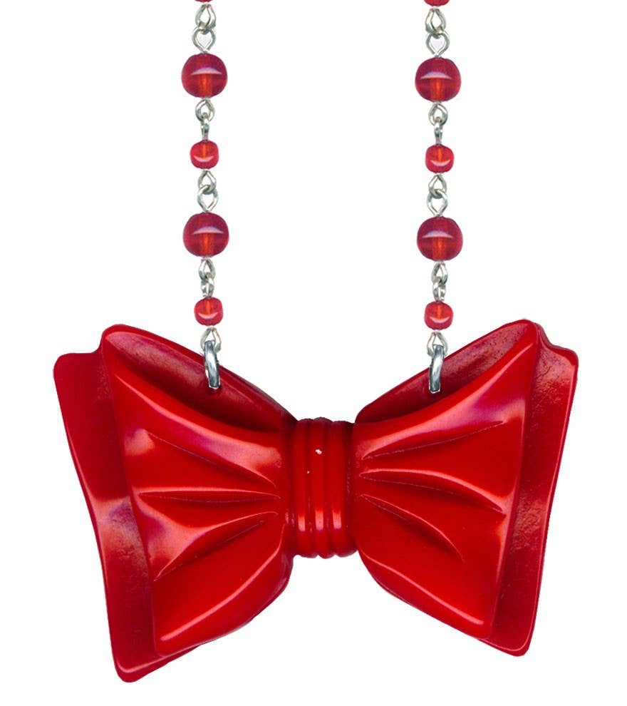 linked translucent round red glass beads necklace with bold red polyresin Retrolite 2 5/8" x 1 3/8" bow pendant