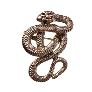 rose gold metal coiled snake brooch with detailed scales and black jeweled eyes