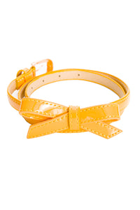 narrow shimmery mustard yellow patent belt with removable bow detail and gold metal buckle