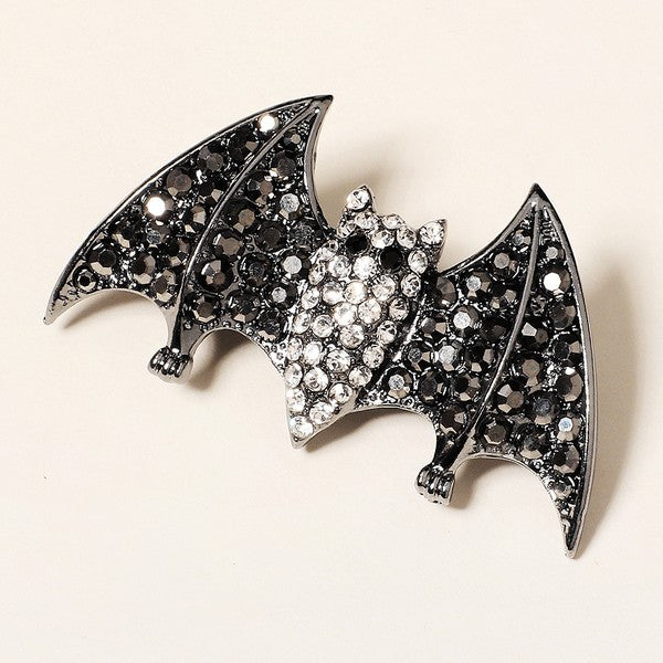 2 5/8" gunmetal finish bat-shaped barrette encrusted with black and clear faceted "rhinestone" jewels on sturdy 2" long pinch release clip fastener