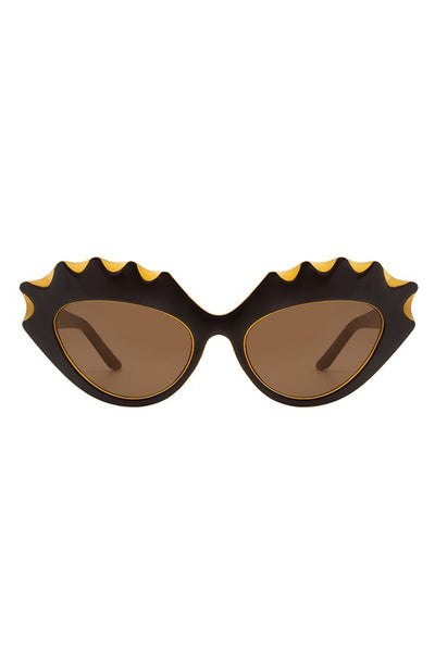 sturdy cat eye translucent caramel color plastic frames with bold "carved" upper eyelashes detail in dark brown and brown lens