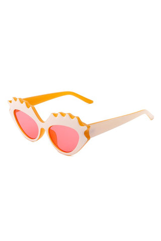 sturdy cat eye translucent deep yellow plastic frames with bold "carved" upper eyelashes detail in white and bright pink lens