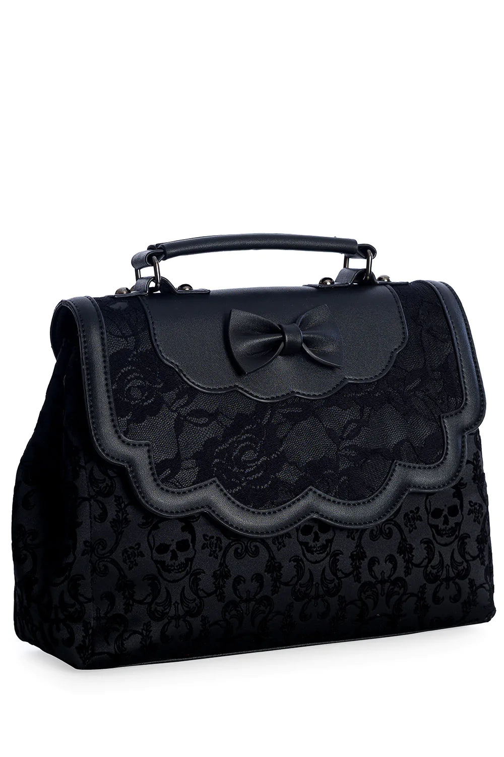A black matte vinyl handbag with damask skull pattern body and a scalloped front flap with a bow and black lace detailing. The bag has a black matte vinyl hand strap and a gunmetal chain shoulder strap.