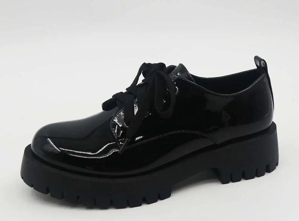 black patent Oxford style shoes with a black chunky textured rubber lug sole