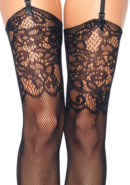 black thigh high fishnet stockings with wide knit-in lace lace design top, shown close up detail on model