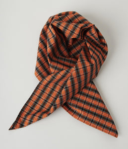 square scarf in a rich orange, black, blue, and burgundy plaid with metallic gold thread accents