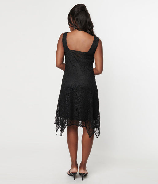 lightweight sleeveless lace 20s style dress featuring draped cowl neckline, paneled skirt with handkerchief hemline, and is fully lined. shown back view on model.