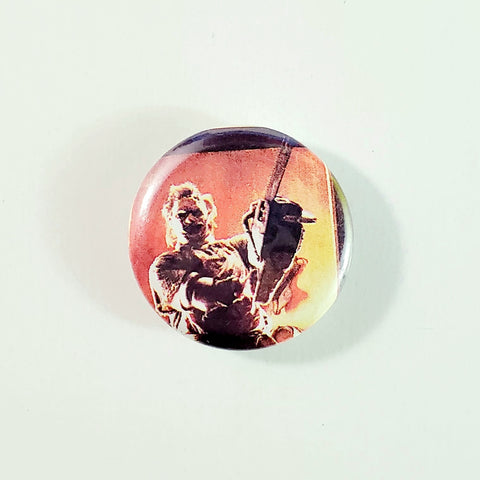 Leatherface weilding chainsaw from the Texas Chainsaw Massacre movie 1.5" round metal pinback button
