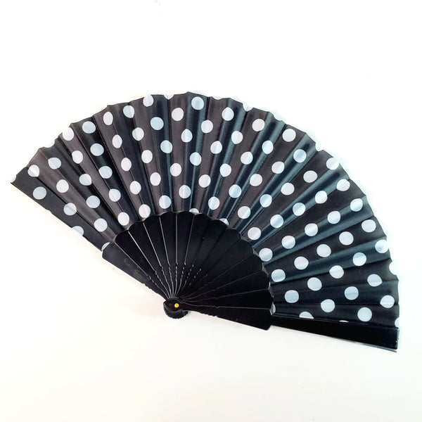 black with white polka dot print fabric folding fan with black plastic ribs