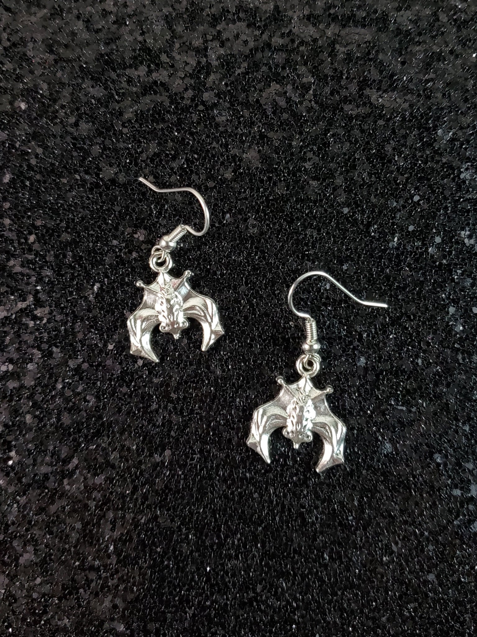 pair silver metal hanging upside down bats dangle earrings