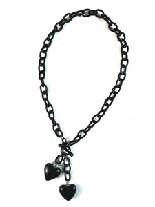 pair black Retrolite heart pendants on 17" black plastic chain with front toggle closure