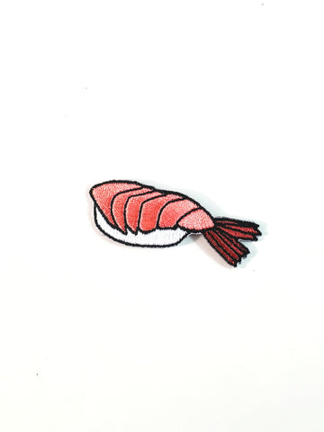 shrimp sushi embroidered patch with black, pink, and white details