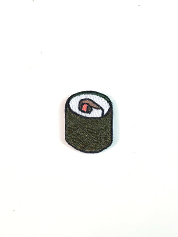 cucumber, crab, and avocado sushi roll, now in patch form! An embroidered patch with brown, pink, and green details