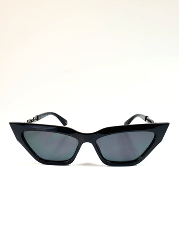 Shiny black plastic frame cat-eye sunglasses with gunmetal cable chain arms and dark smoke lens