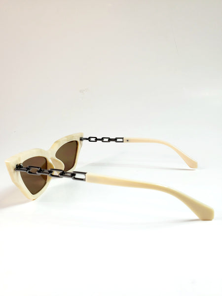 Shiny marbled pattern cream plastic frame cat-eye sunglasses with gunmetal cable chain arms and reflective brown lens, shown from the side