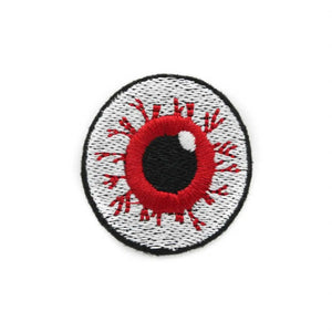 embroidered patch of a bloodshot eyeball with a bright red iris and a thin black border 