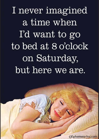 "I never imagined a time when I'd want to go to bed at 8 o'clock on Saturday, but here we are." message above smiling gal in bed photo image rectangular refrigerator magnet