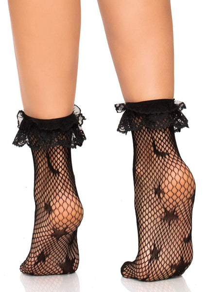 black fishnet ankle sock in knit-in scatter pattern of stars & crescent moons, finished with a reinforced toe and lace ruffle top, shown on model