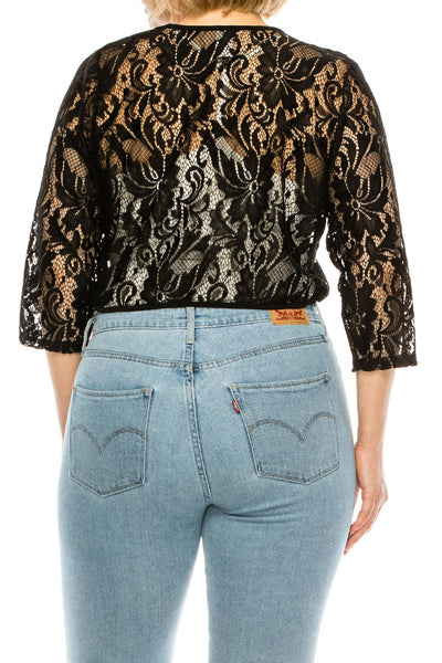 black floral patterned lace 3/4 sleeve bolero with solid black trim worn by a model shown from the back