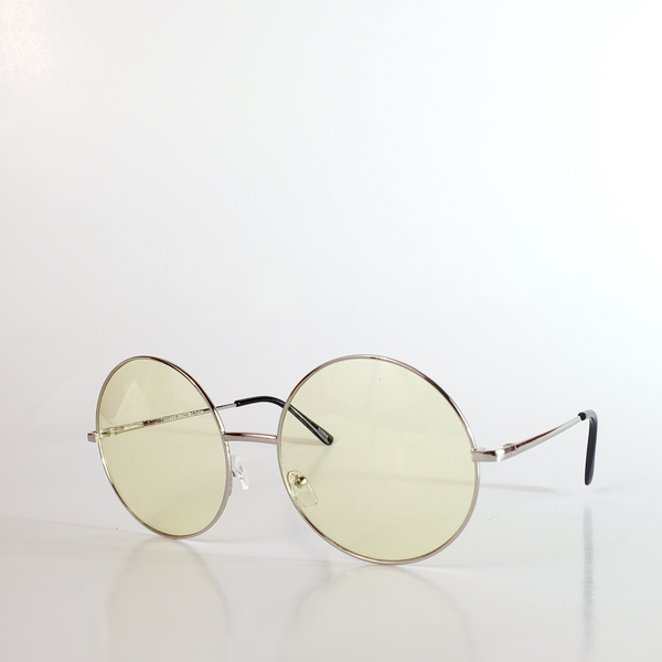 round sunglasses with thin silver metal frames and pale yellow tinted lenses
