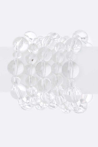 set of 5 bracelets of varied size shiny clear acrylic beads strung on stretch filament