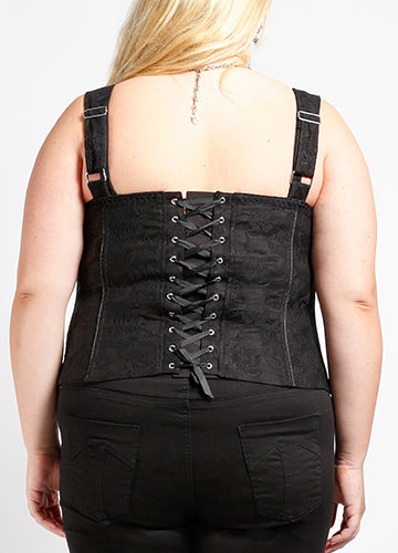 black rose pattern lace overlay on sturdy black stretch cotton corset top featuring a straight neckline, adjustable straps, channels of light boning highlighted with black cord detail, shiny silver metal hook & eye closure down the front, and grosgrain ribbon through silver eyelets lace-up back. Shown back view on model.