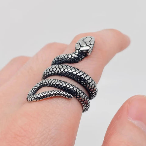 stainless steel snake wraparound ring, shown on a finger