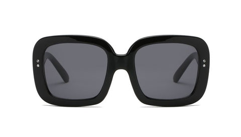Oversized sunglasses with thick square frames and small rhinestone detailing at each temple. The frames are black.