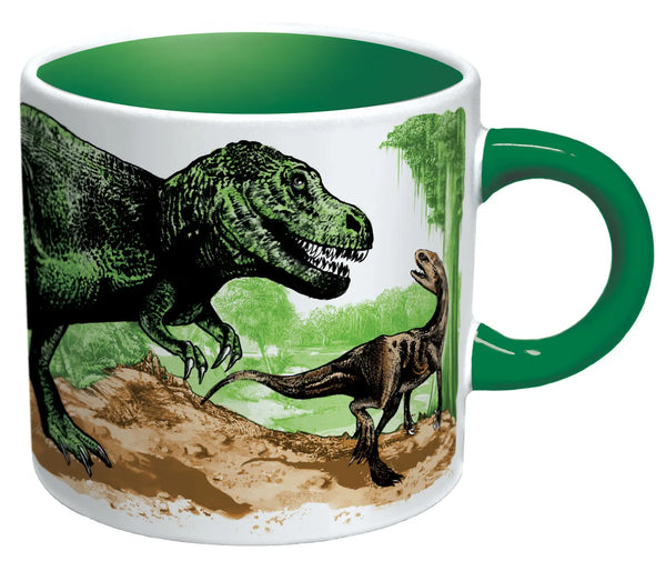 A ceramic mug with green handle and inside showing a large t.Rex and velociraptor in a jungle scene in full color 