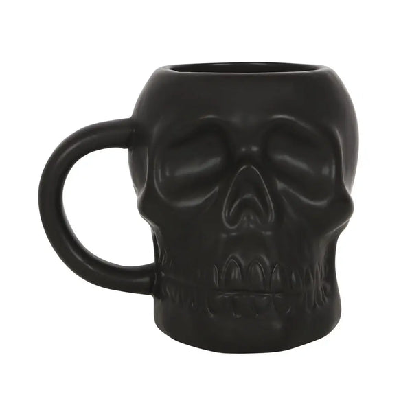 A black satin finish ceramic mug in the detailed shape of a skull
