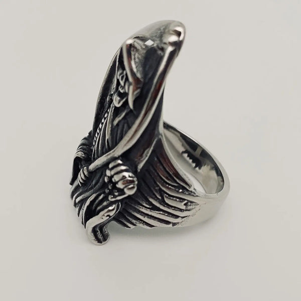 stainless steel ring depicting the grim reaper with his scythe, shown side view