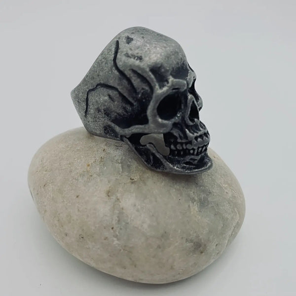 aged finish stainless steel skull ring, shown 3/4 view