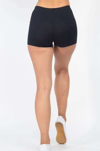 A model wearing black soft and stretchy brushed fiber knit high-waisted shorts with an elastic waistband. Shown from behind 