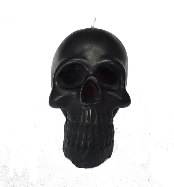 4” tall black skull-shaped candle that “bleeds” red wax when lit. Shown unlit 