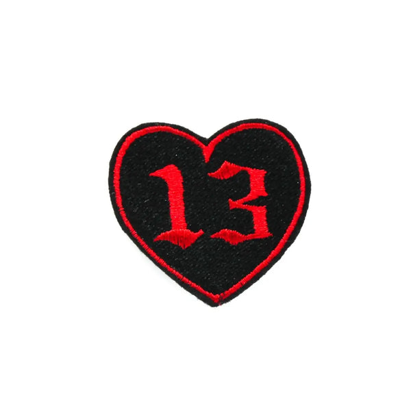 Embroidered black heart with a red outline and the number 13 in red in a gothic font