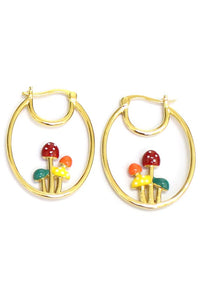 A pair of gold metal oval shaped hoop earrings with enameled orange, red, green, and yellow mushrooms in the middle of each hoop  