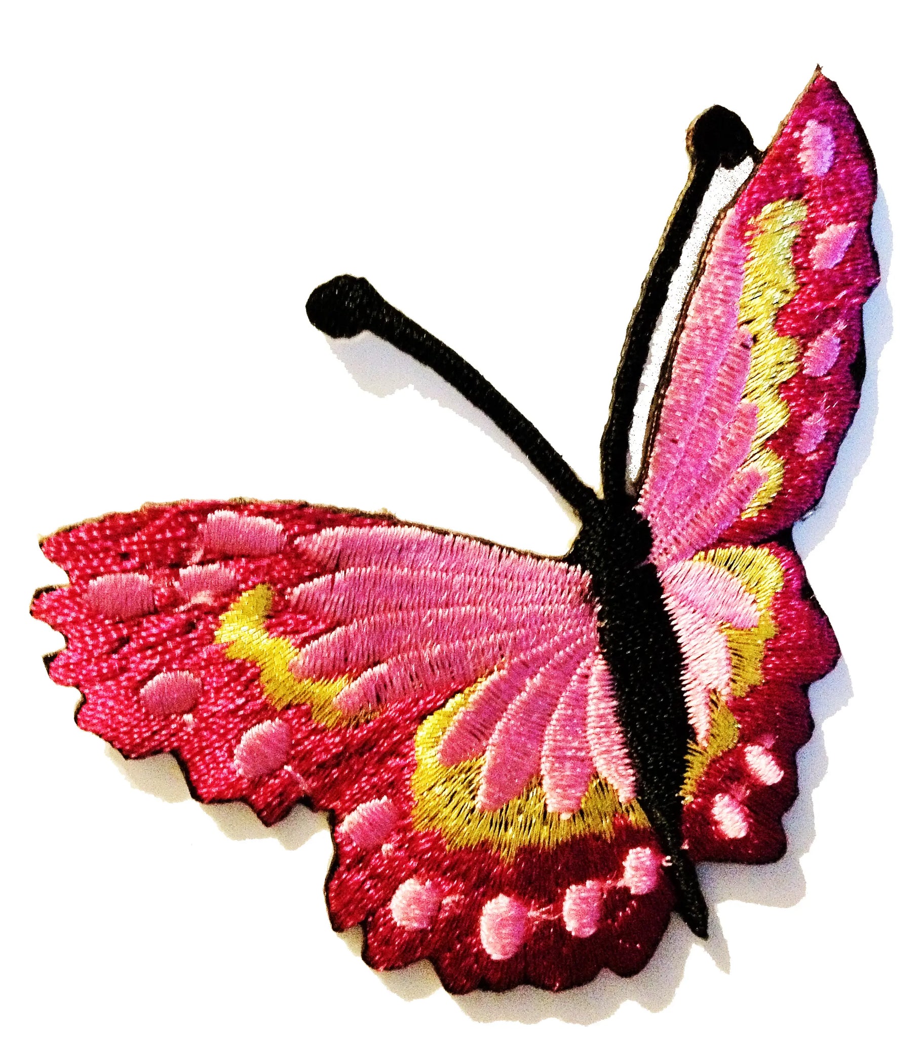 An embroidered patch of a butterfly flying away with dark pink and lighter pink wings & gold details 