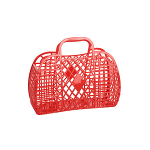 A small red rectangular handbag made of plastic with a retro diamond and lattice pattern