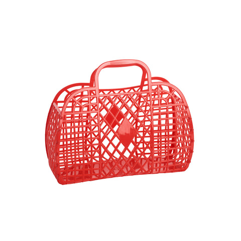 A small red rectangular handbag made of plastic with a retro diamond and lattice pattern