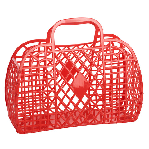 A large red rectangular handbag made of plastic with a retro diamond and lattice pattern