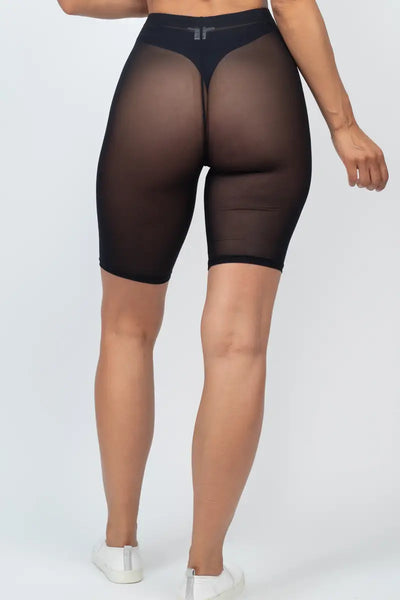 A model wearing black sheer mesh bike shorts. Shown from behind